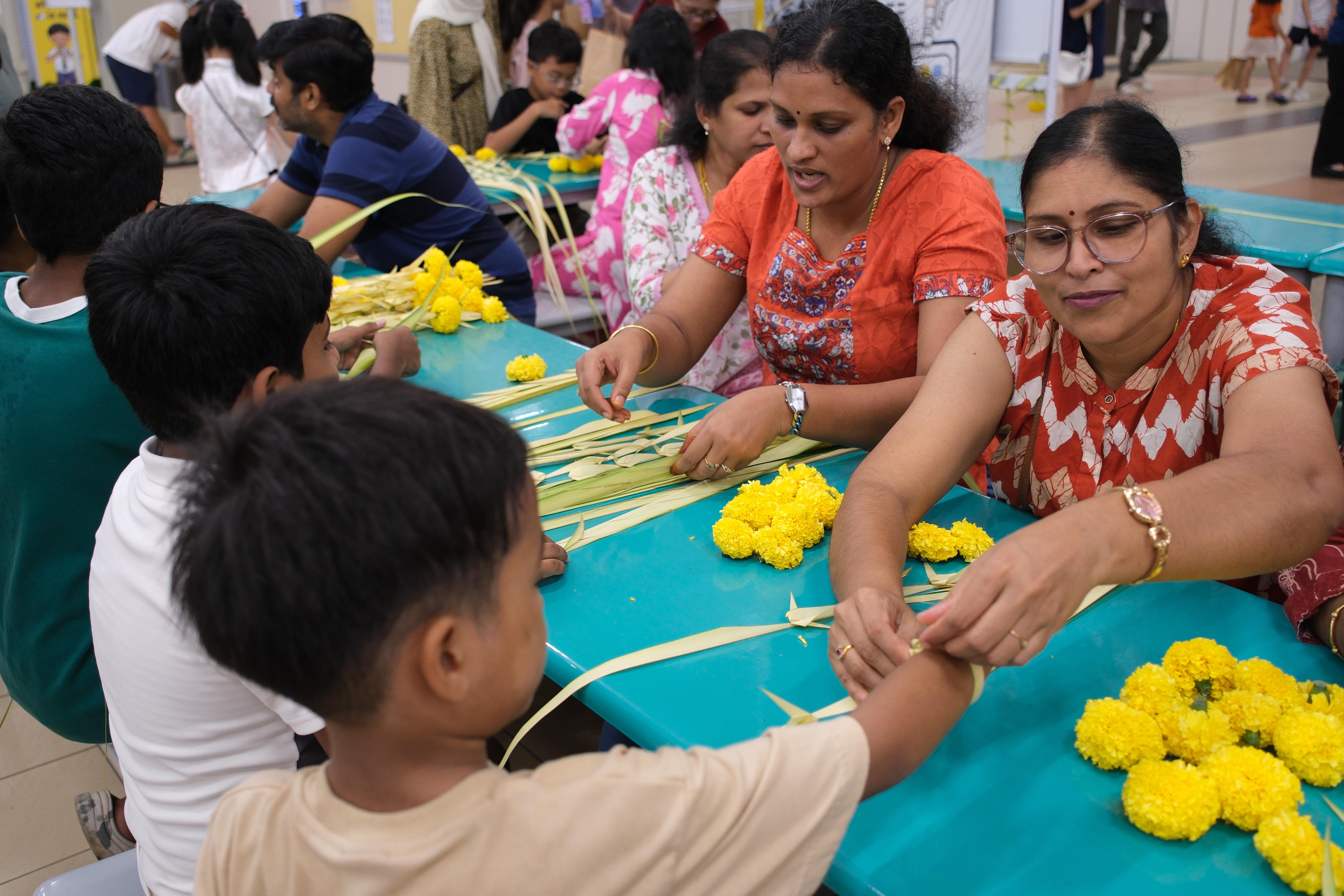 Weaving traditions, creating memories! Families learn a traditional craft together, one strand at a time.